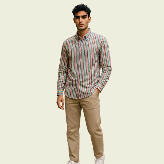 Man wearing striped shirt on beige background