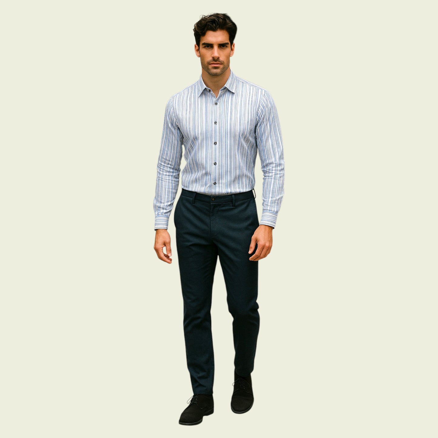 Man wearing a striped shirt and dark pants on a beige background
