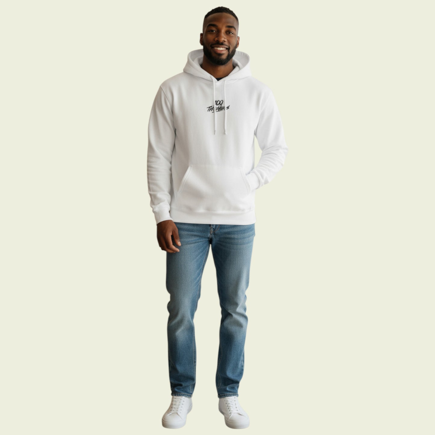 Man wearing a white hoodie and blue jeans on a beige background