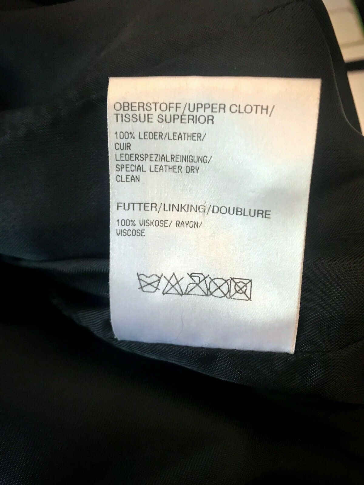 Clothing label with text on a black garment