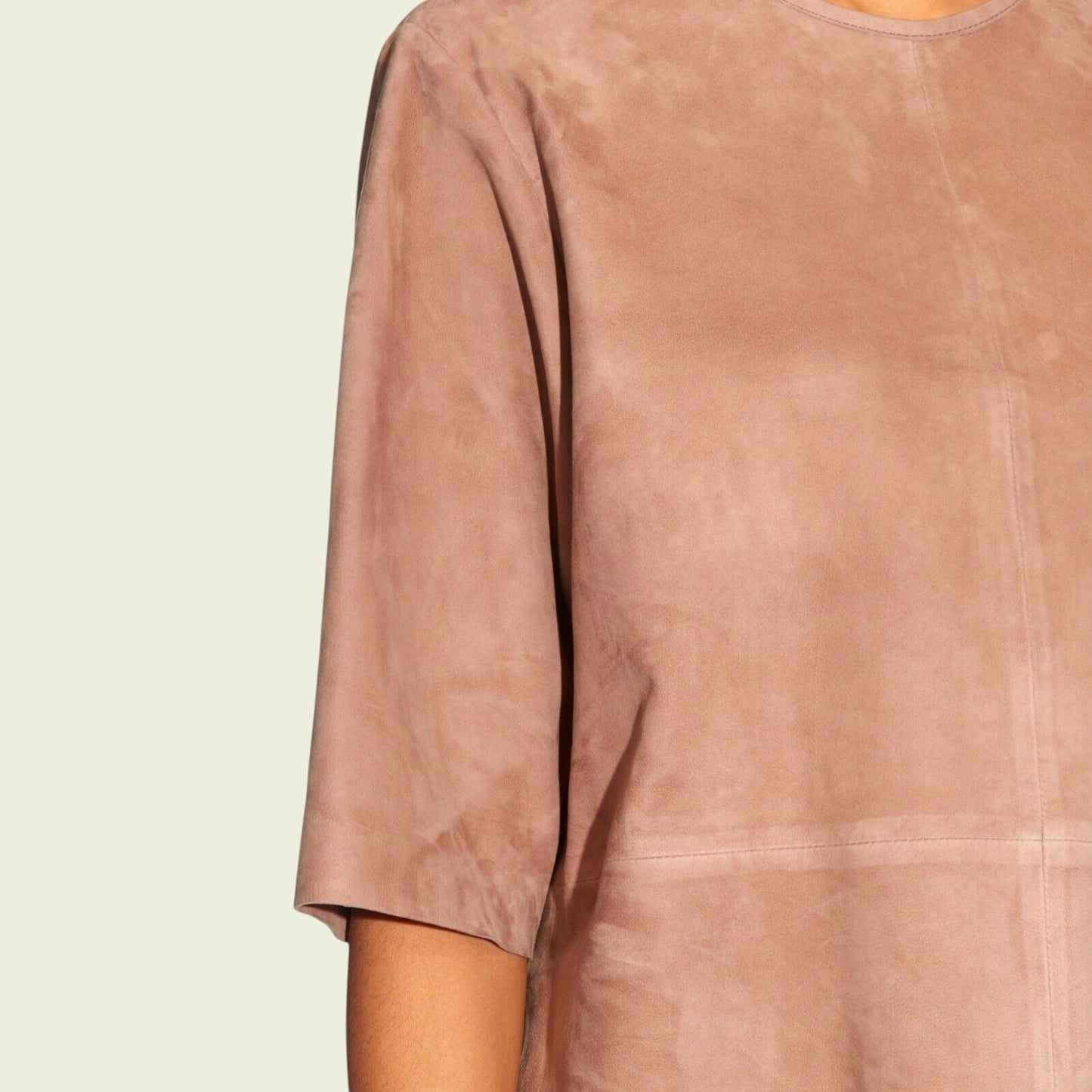 Tan suede top on a beige background