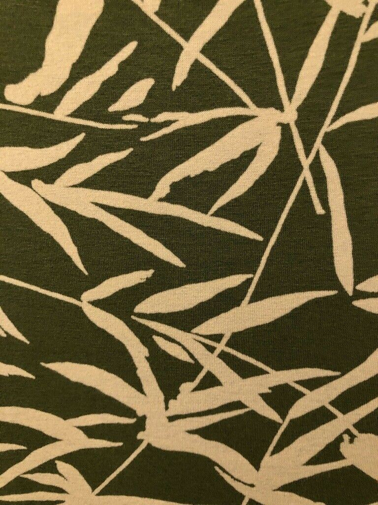 Beige bamboo leaf pattern on a dark green background