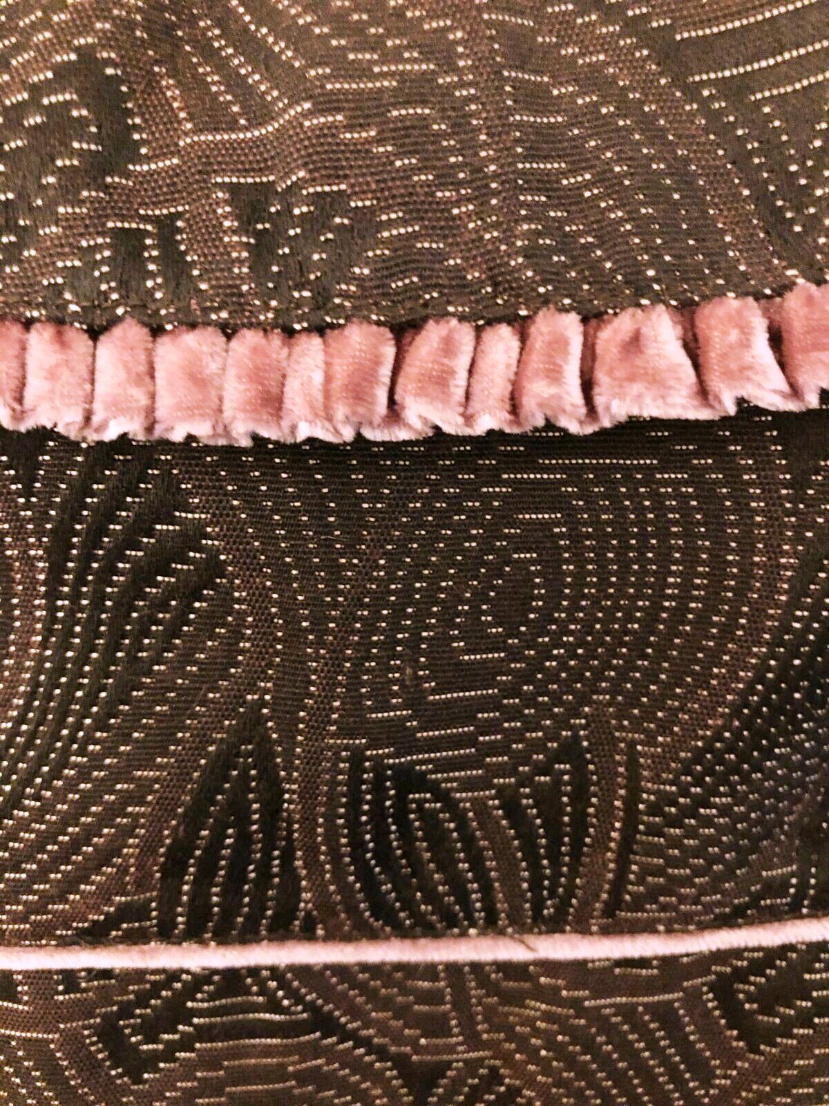 Close-up of a textured fabric with a patterned edge