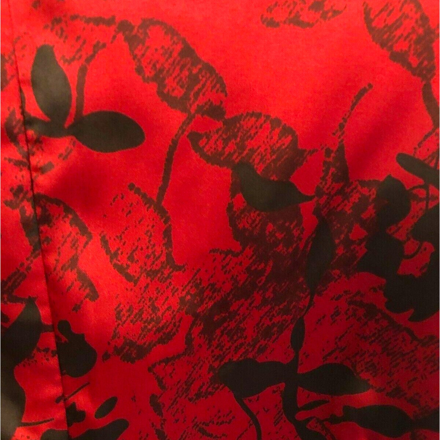 Red fabric with black floral pattern