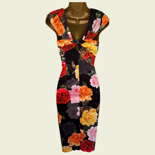Floral dress on a mannequin against a beige background