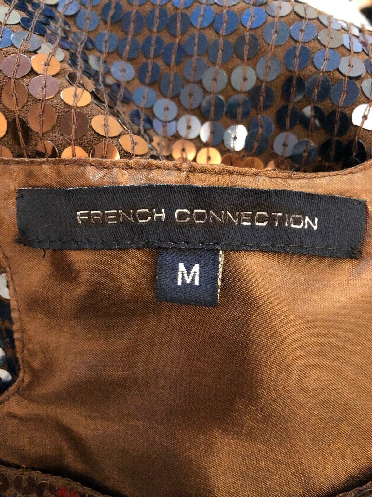 Brown fabric with a 'French Connection' label and size 'M'.
