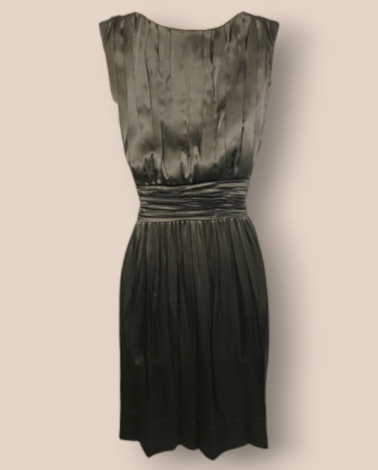 Black dress with a textured pattern on a beige background