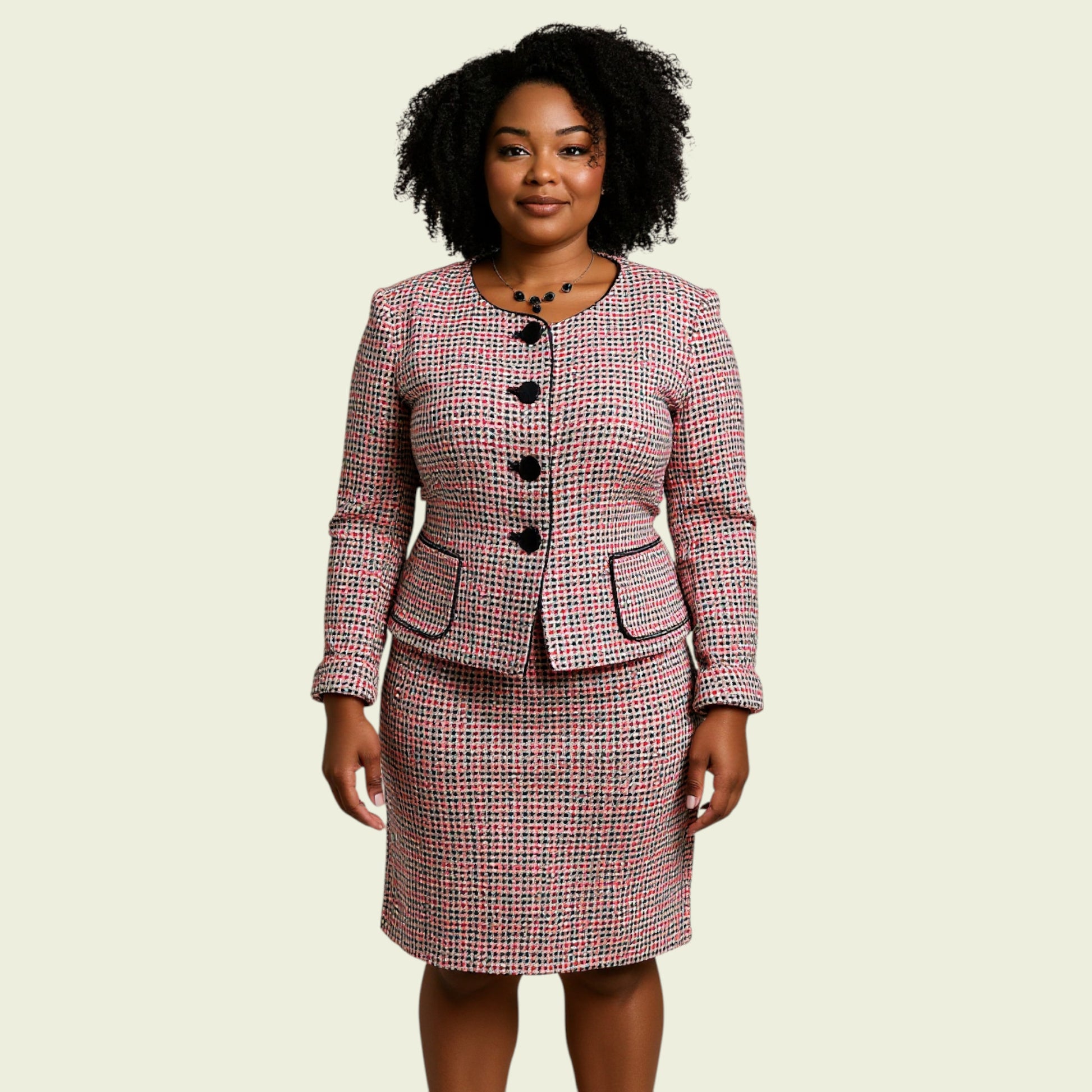 Woman wearing a checkered suit on a beige background