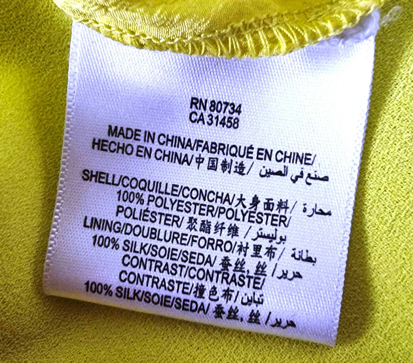 Clothing label with text on a yellow background