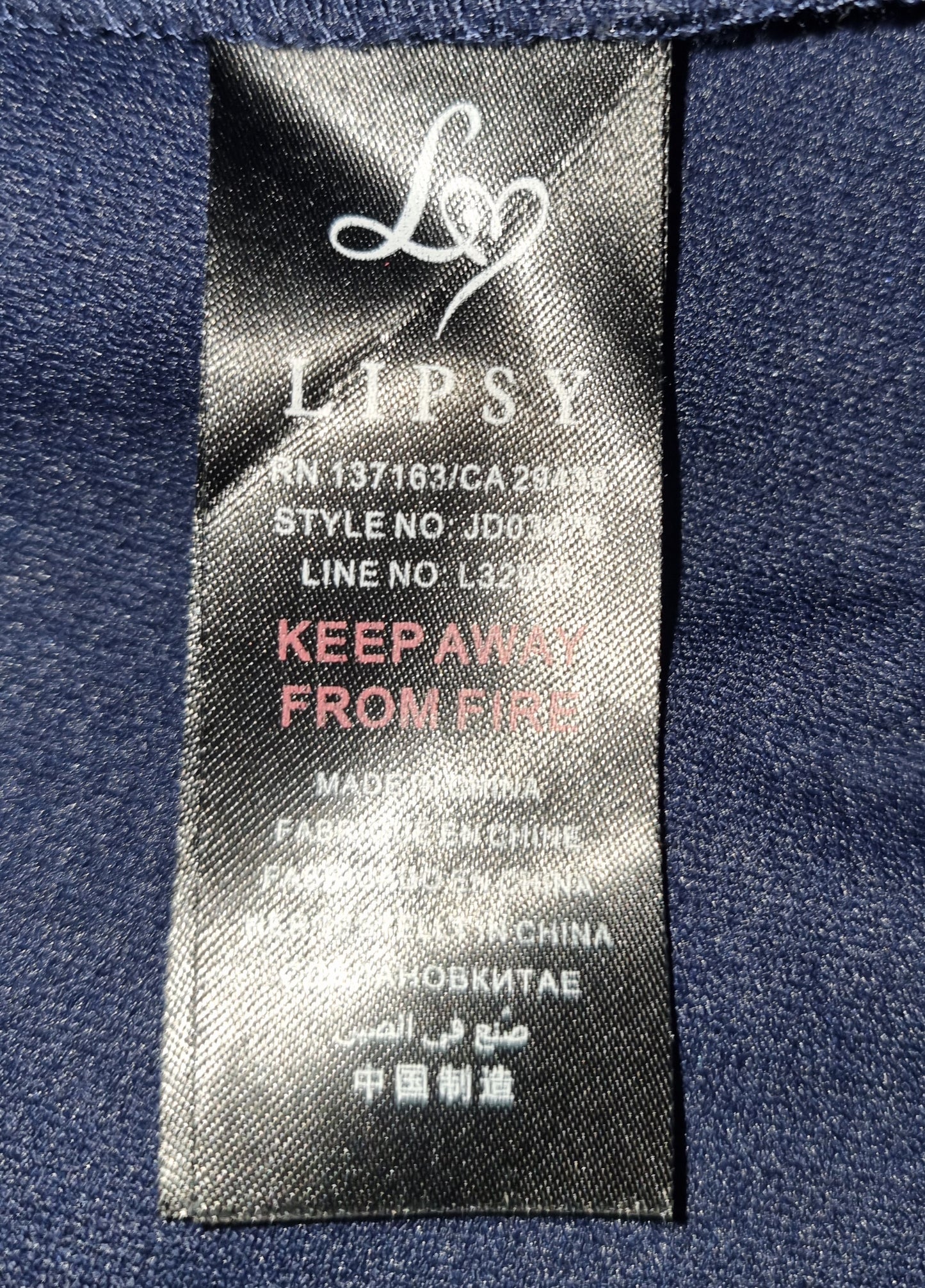 Lipsy label on a navy blue garment with text and branding.