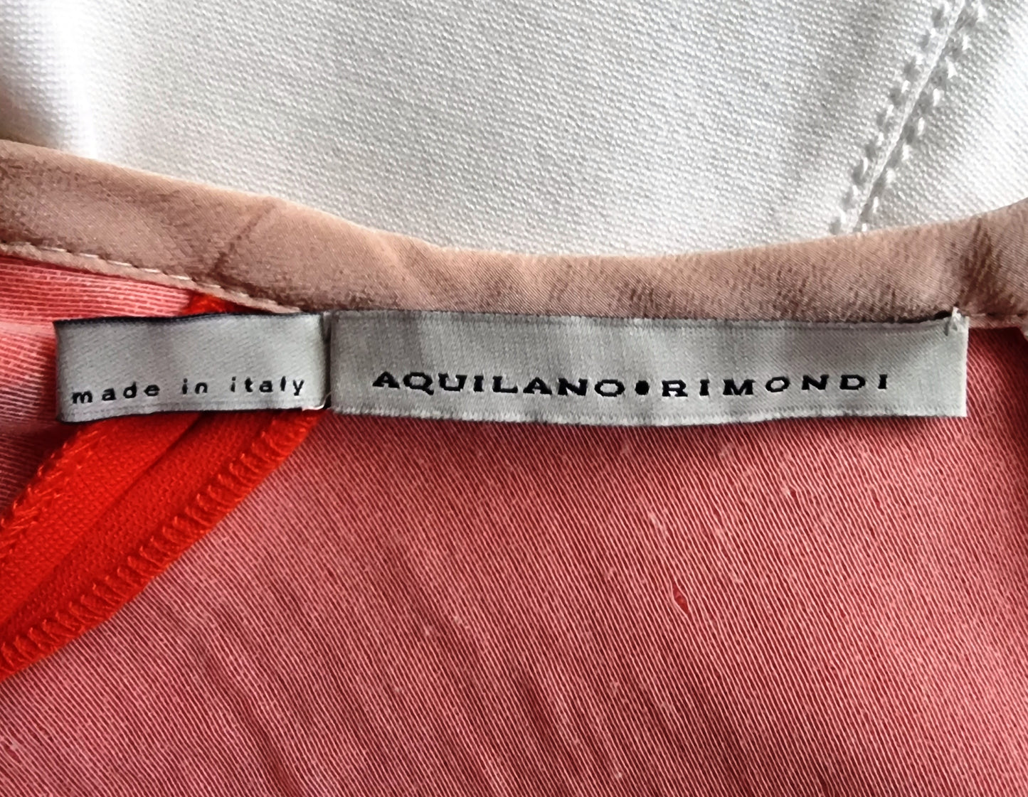 Aquilano Rimondi label on a garment with 'made in Italy' text.