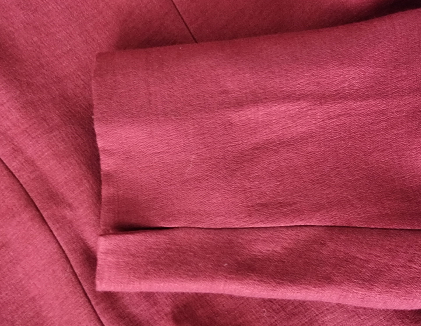 Close-up of red fabric with a textured pattern