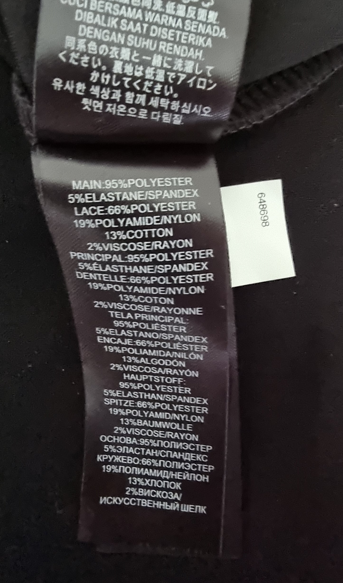 Textile label with material composition details on a black background