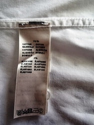 label showing fabric content on white background