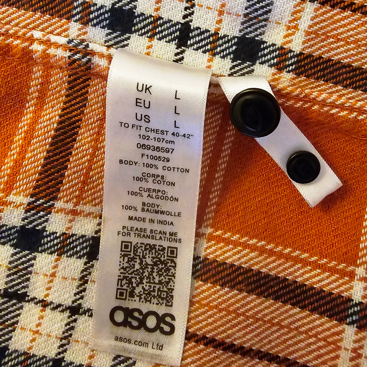 ASOS label on a plaid fabric background
