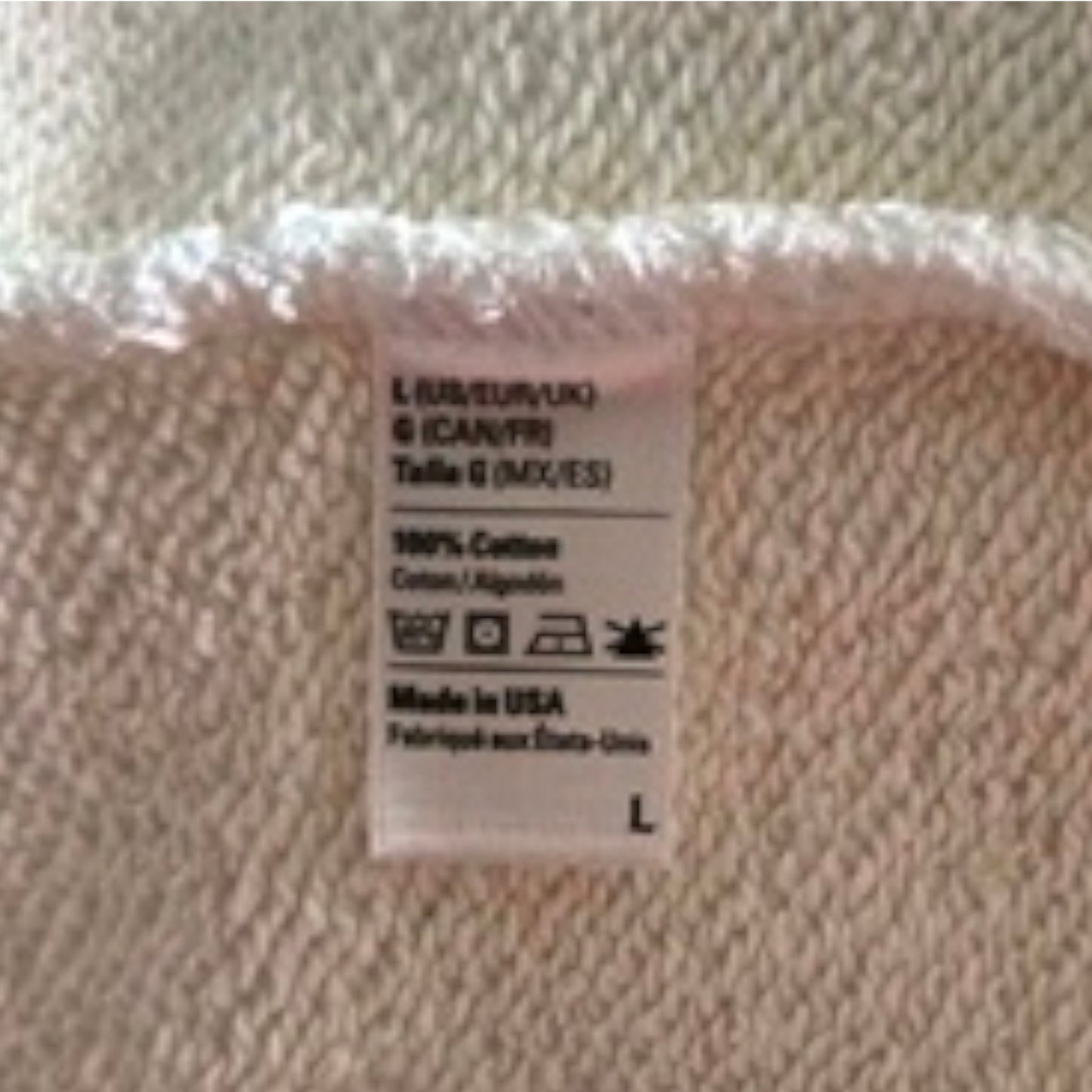 Textile label on a beige fabric background