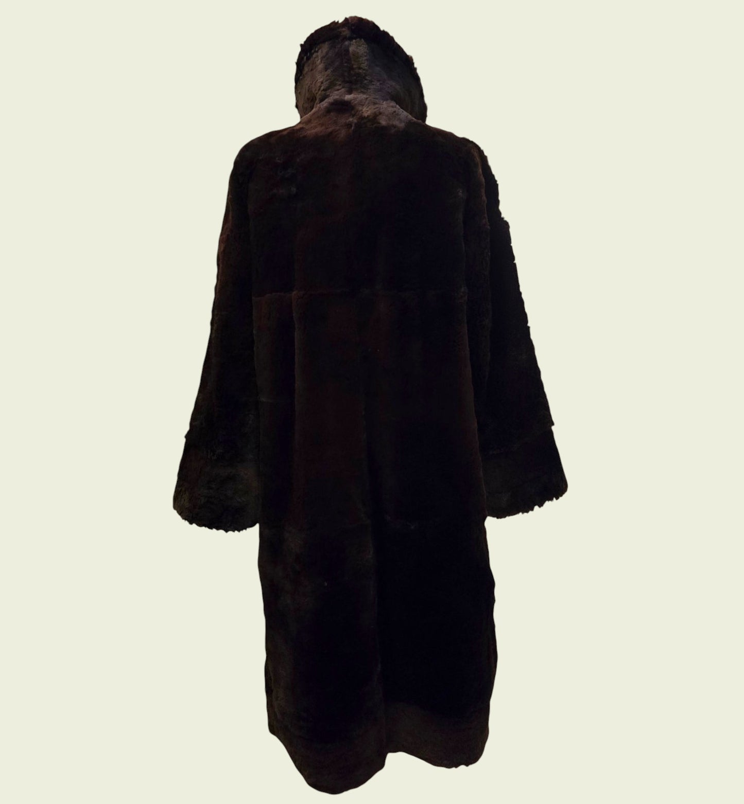 Brown fur coat on a light beige background