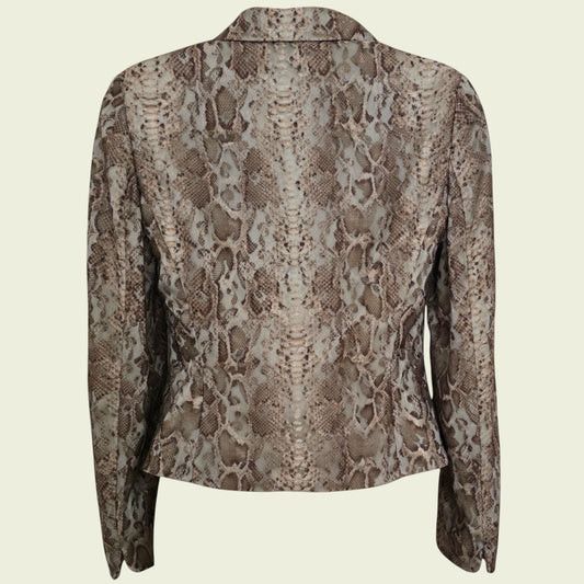 Snakeskin patterned jacket on a beige background