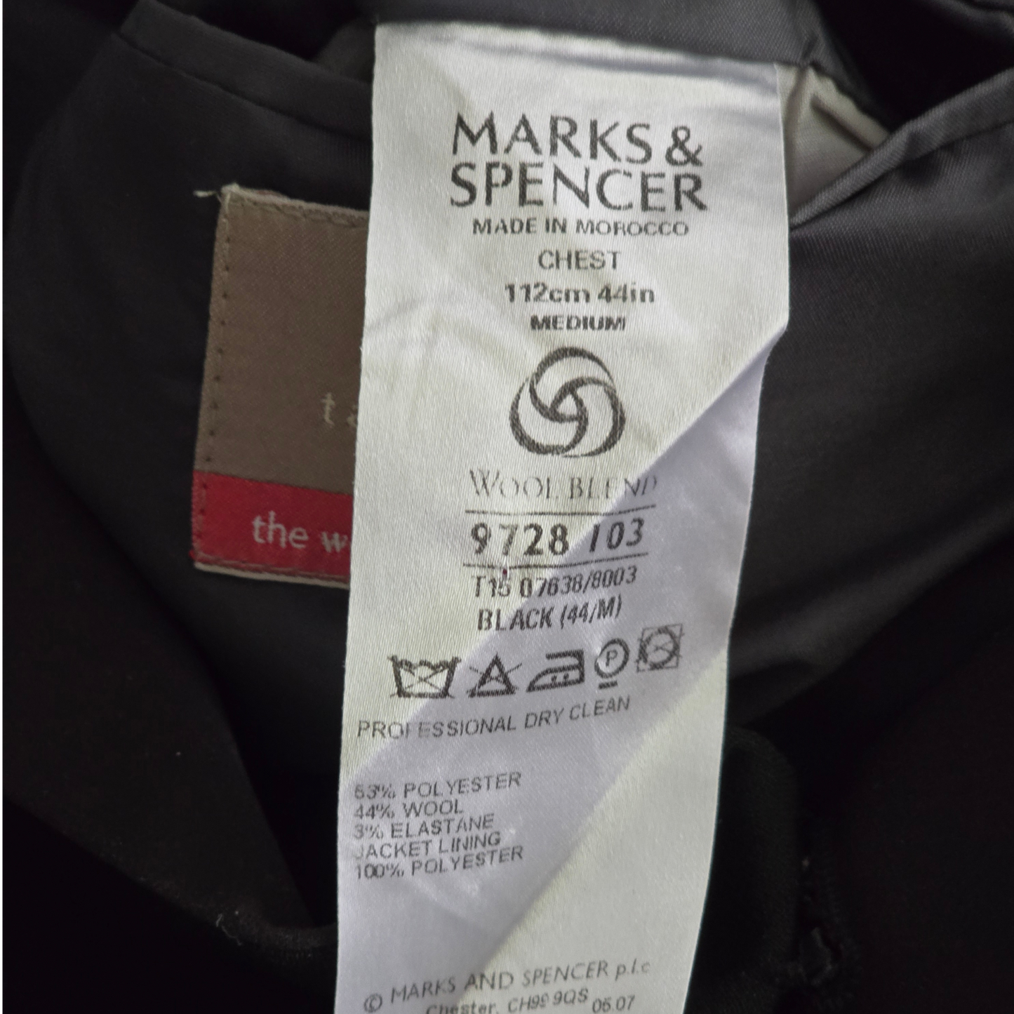 Marks & Spencer label on a garment with text and symbols.
