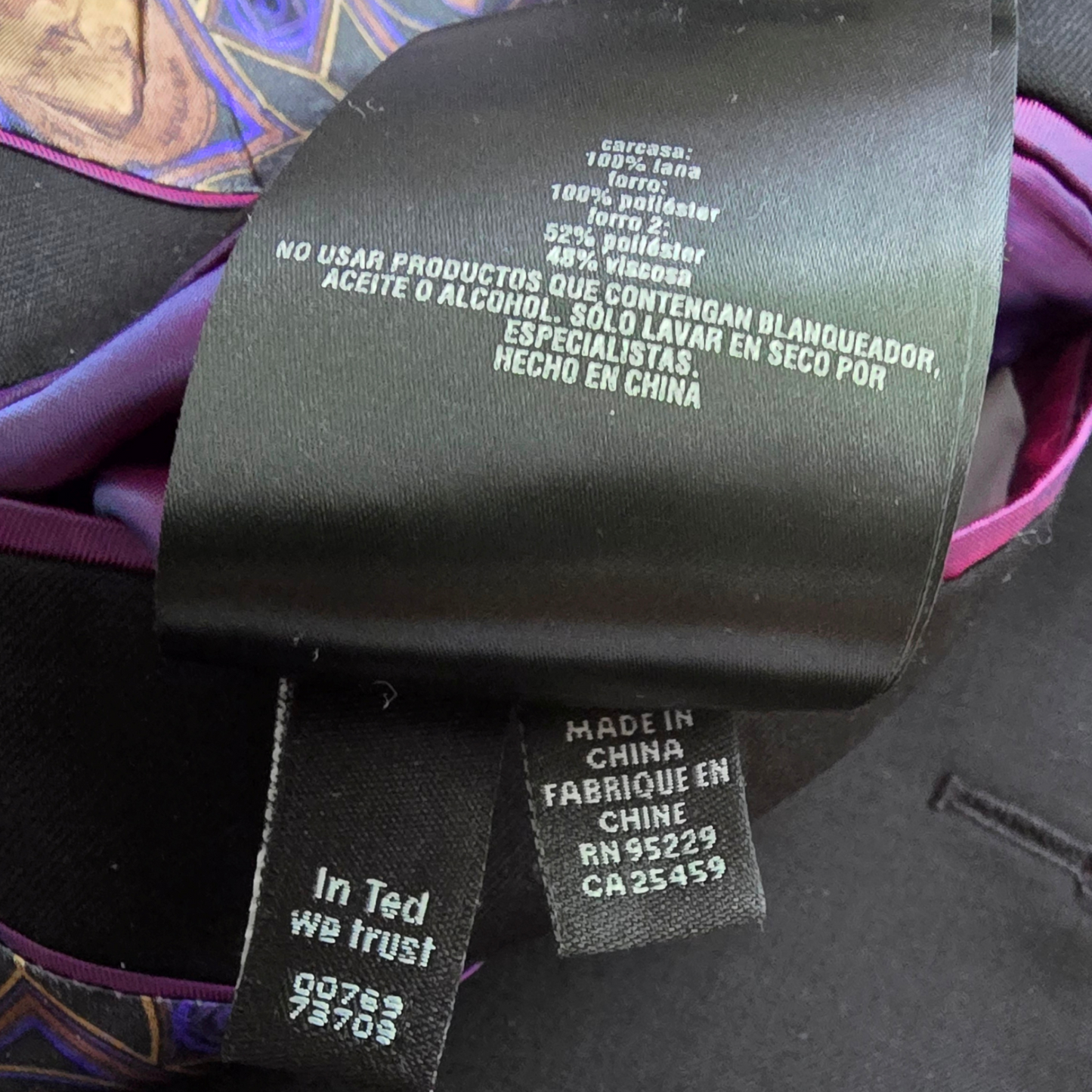 Close-up of fabric labels on a garment with text and product details.