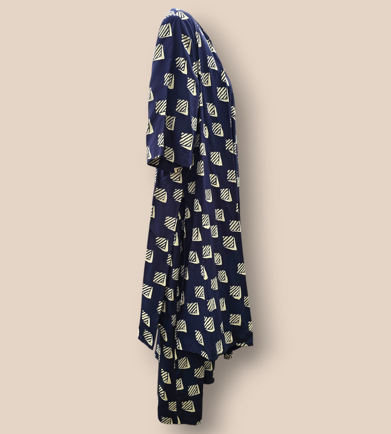 Navy blue scarf with geometric pattern on a beige background