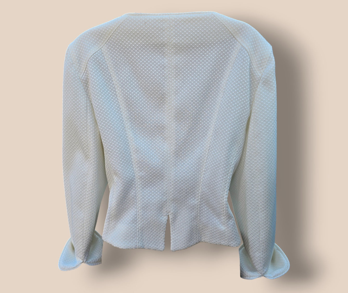 White textured jacket on a beige background