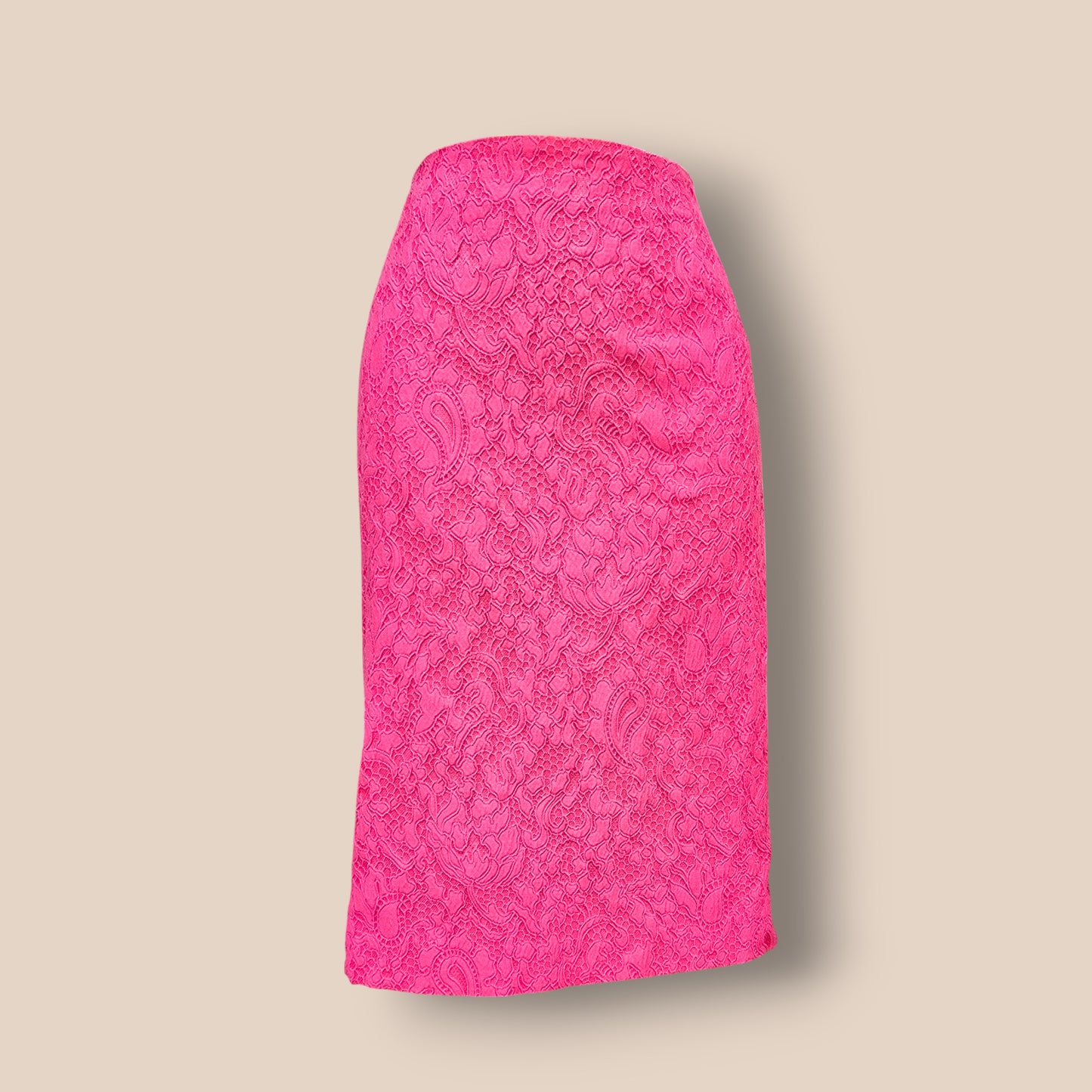 Pink lace skirt on a beige background