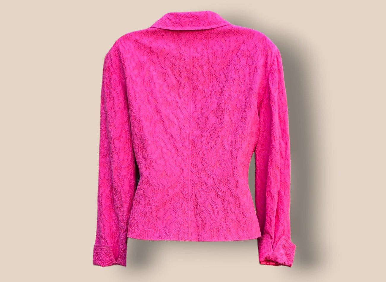 Pink textured shirt on a beige background