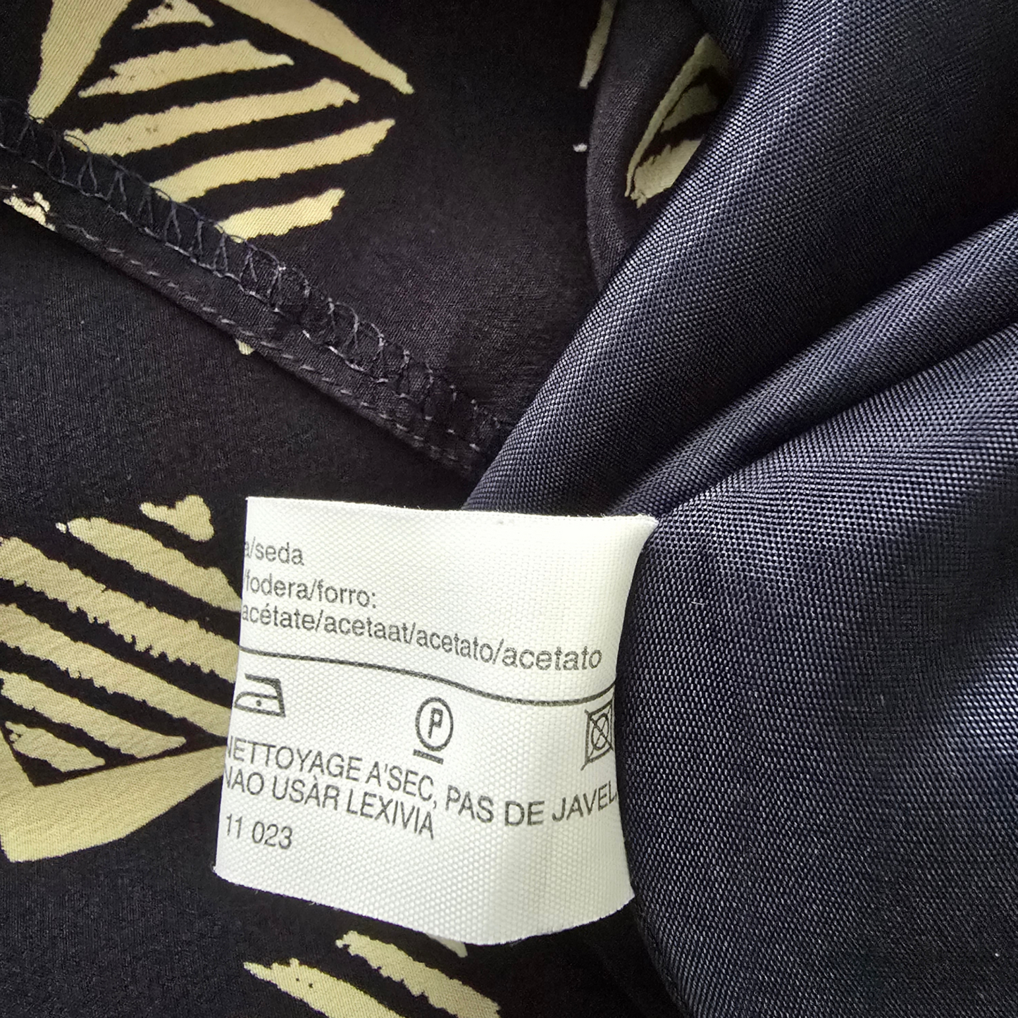 Clothing label on a garment with leaf pattern