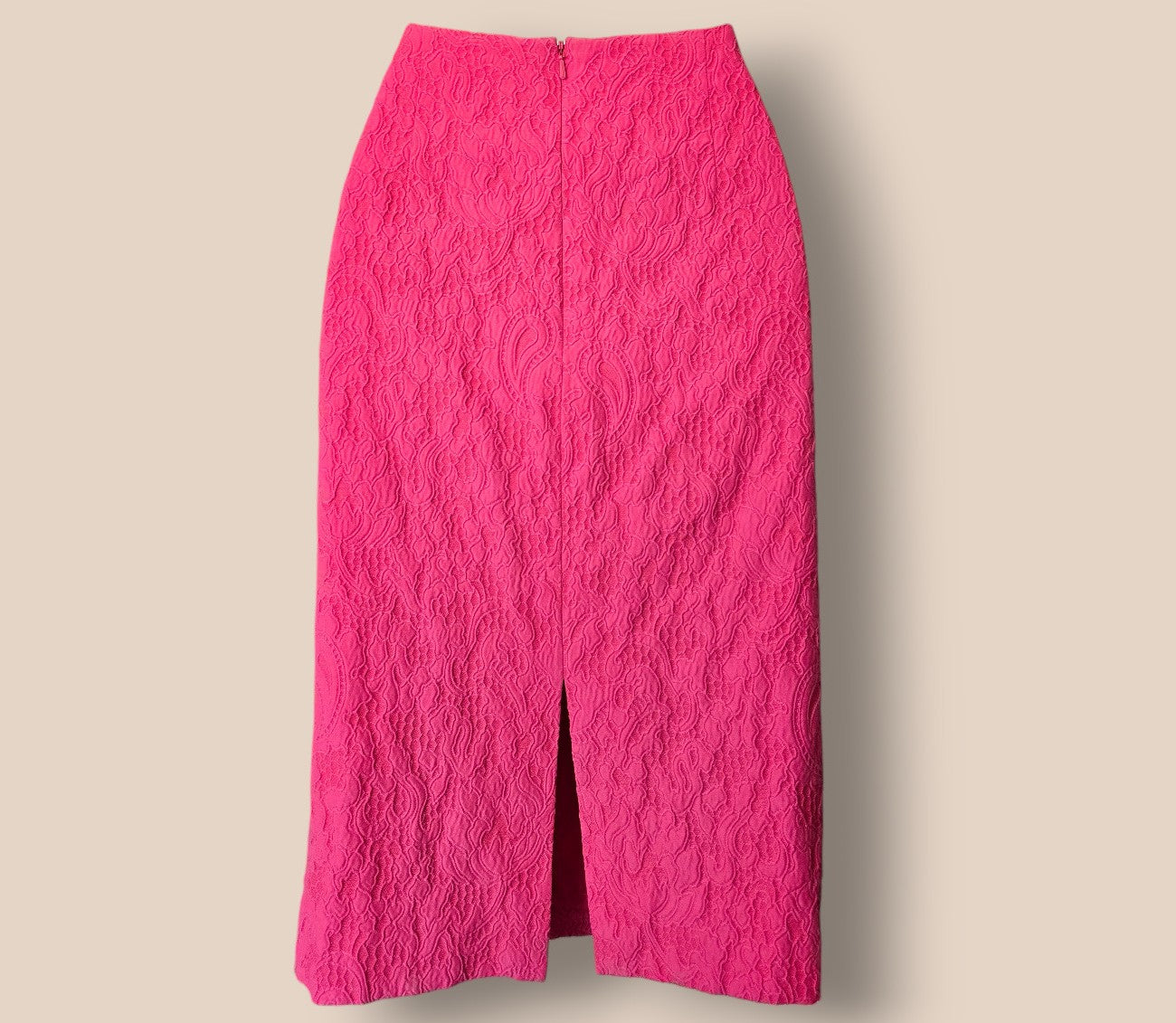 Pink textured skirt on a beige background