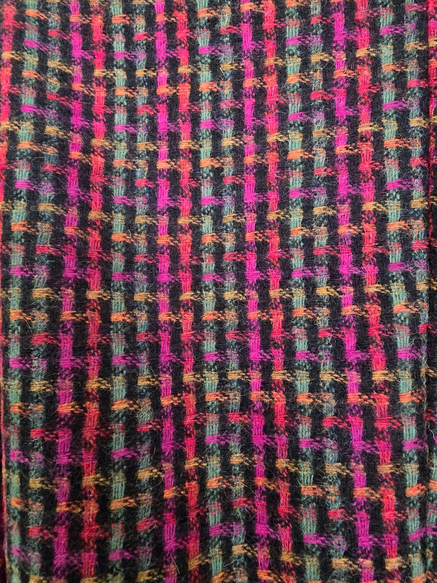 Multicolored fabric pattern on a black background