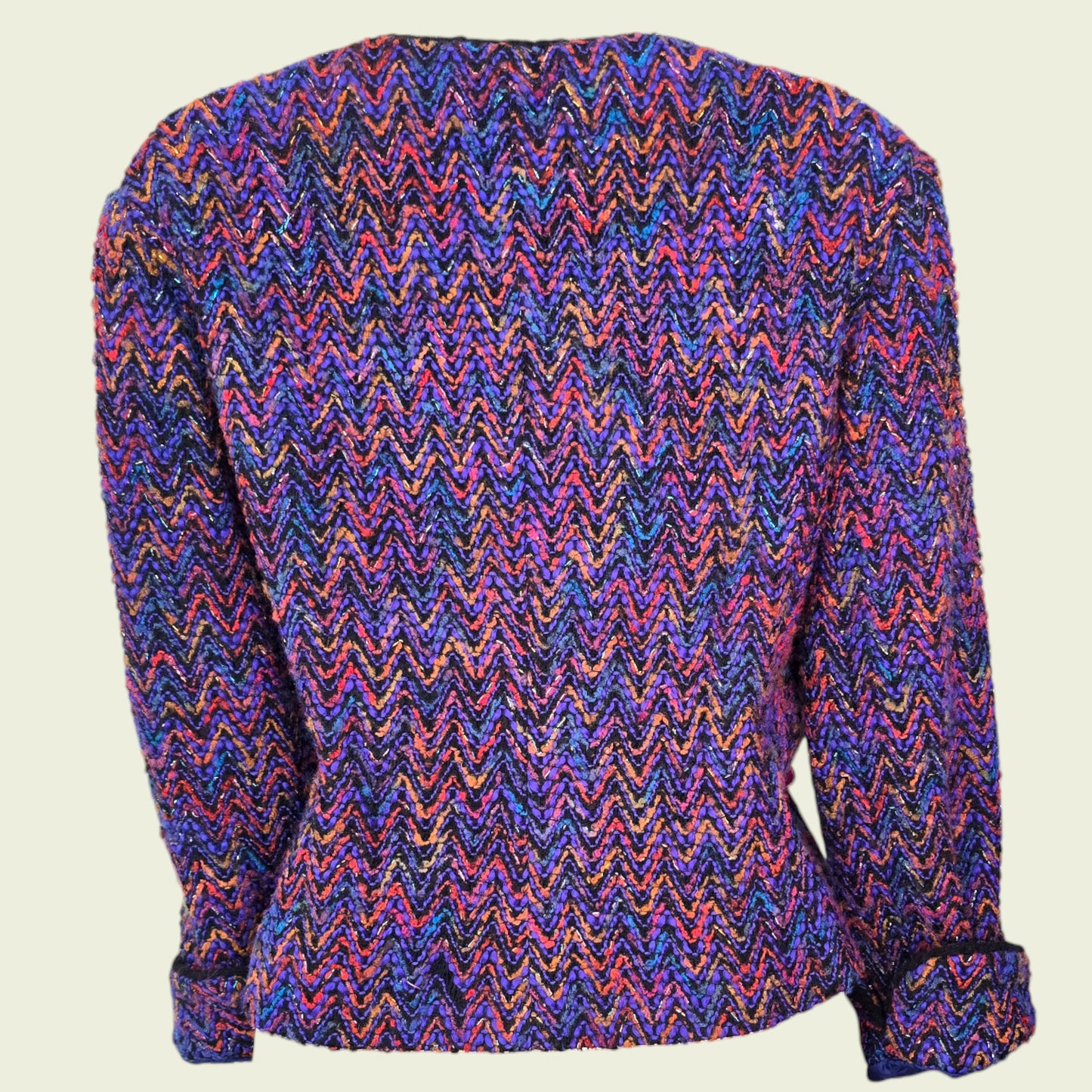 Multicolored zigzag patterned jacket on a beige background