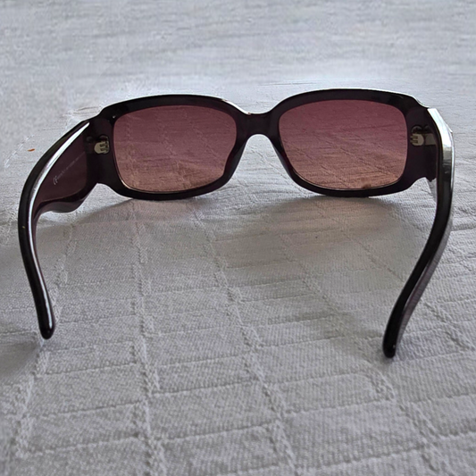 Mauve sunglasses on a white background