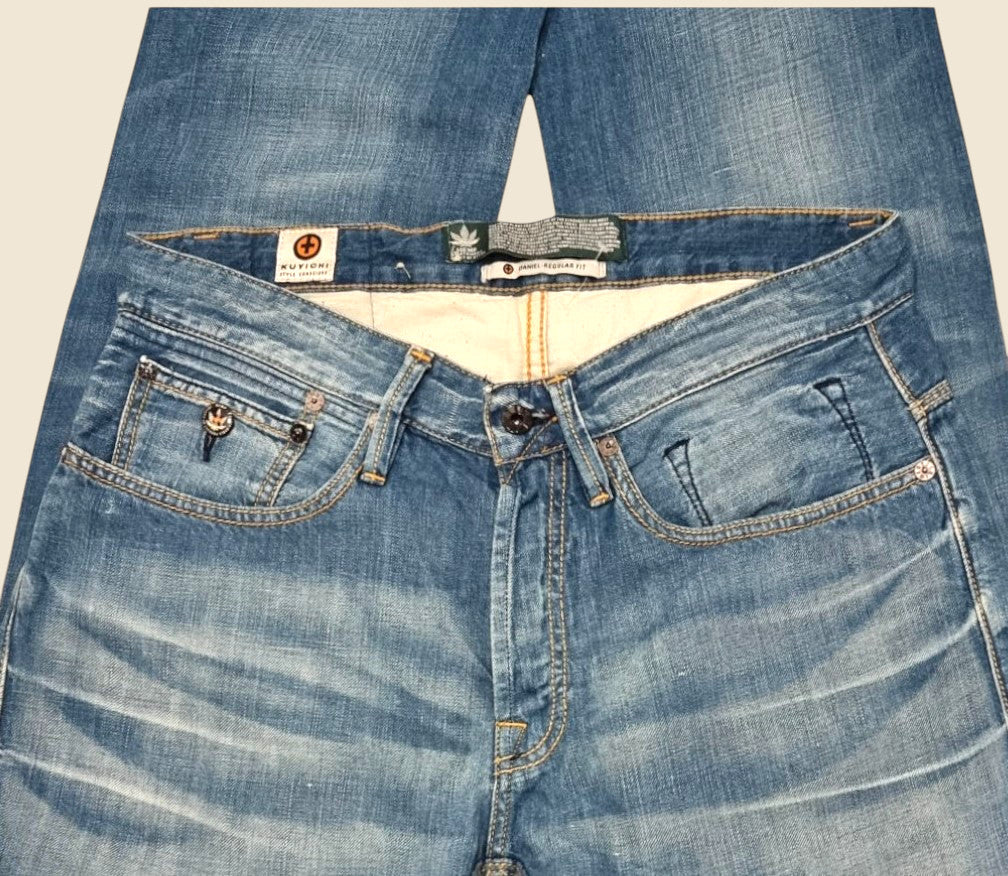 Blue jeans with brand labels on a light background