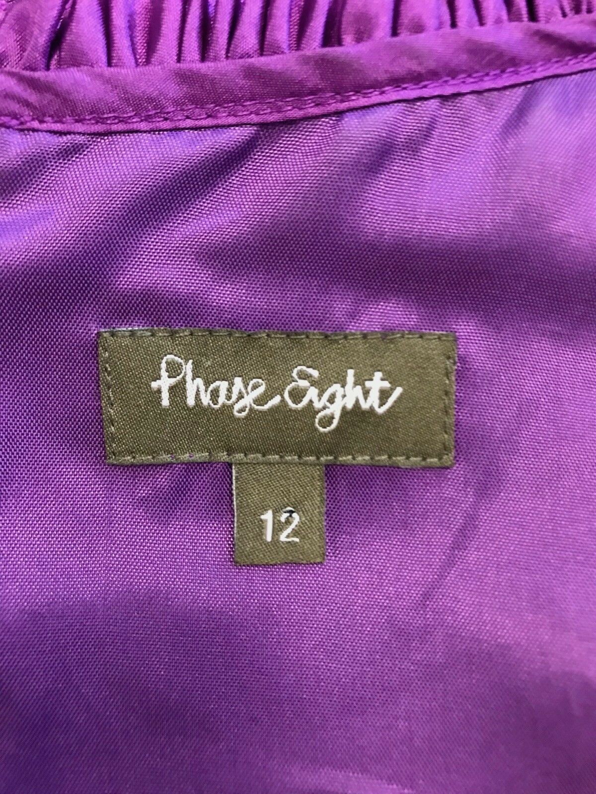 Purple fabric with a 'Phase Eight' label on a purple background
