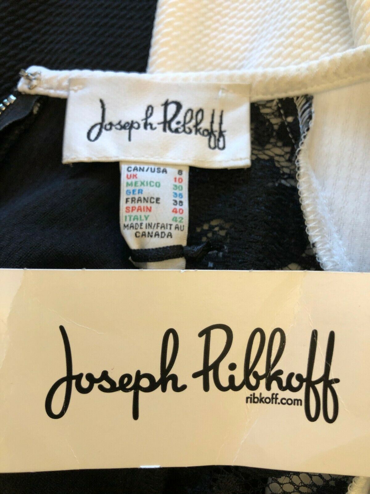 Close-up of Joseph Ribkoff clothing tag with brand name and website.