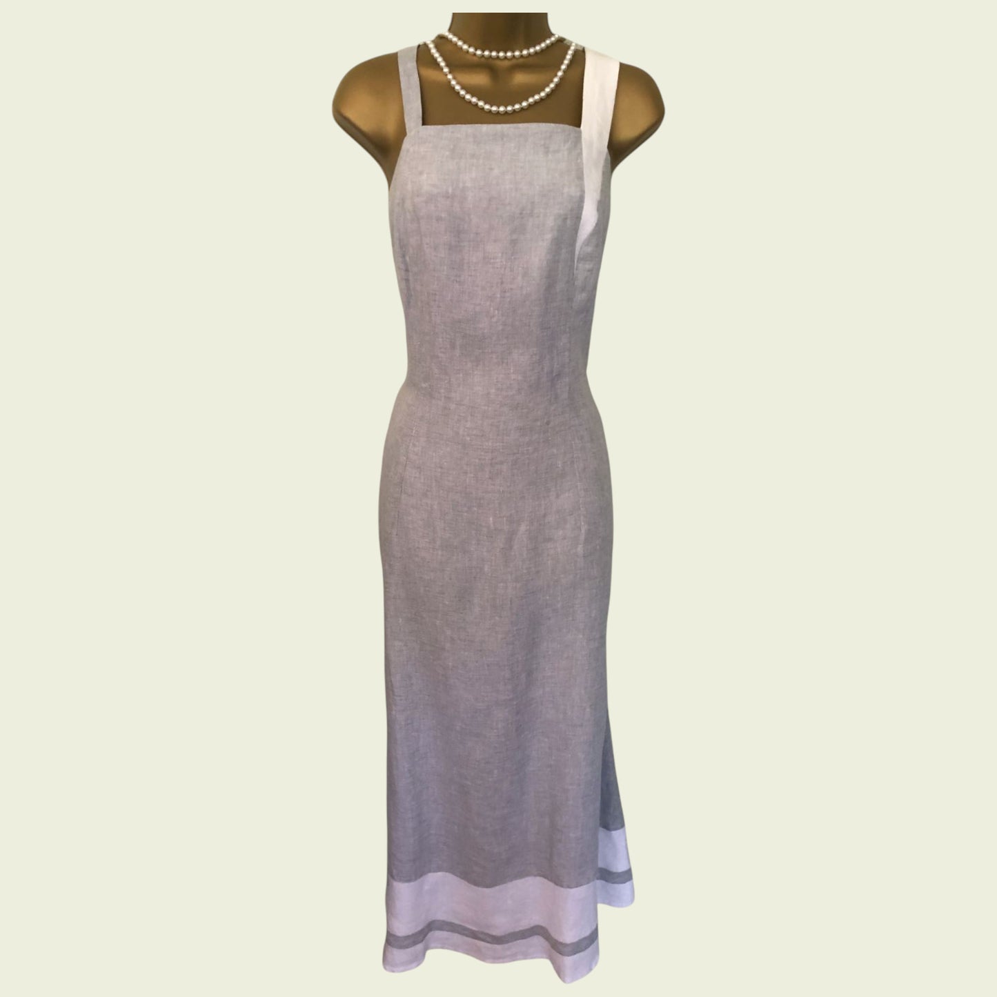 Light purple dress on a mannequin with a white background