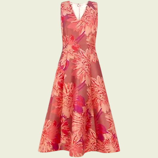 Floral dress with pink and red pattern on a beige background