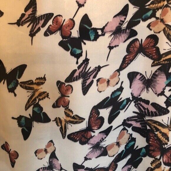 Pattern of colorful butterflies on a light background