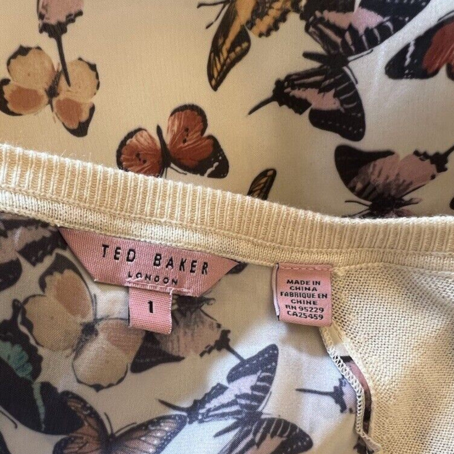 Ted Baker London tag on a garment with butterfly pattern