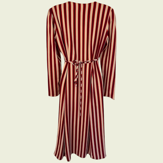 Red and white striped dress with a belt on a beige background