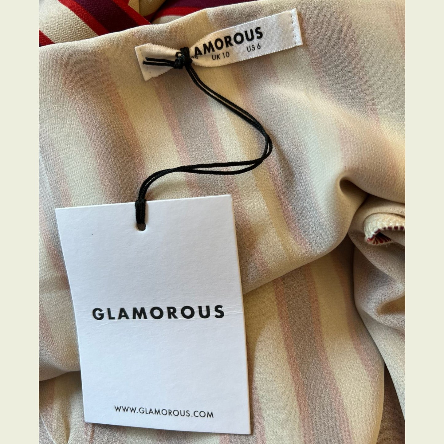 Glamorous brand tag on a piece of fabric