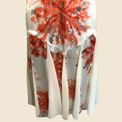 Skirt with red floral pattern on a beige background