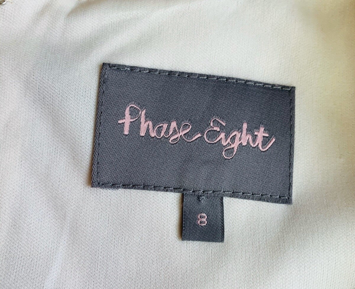 Label with 'Phase Eight' branding on a light fabric background