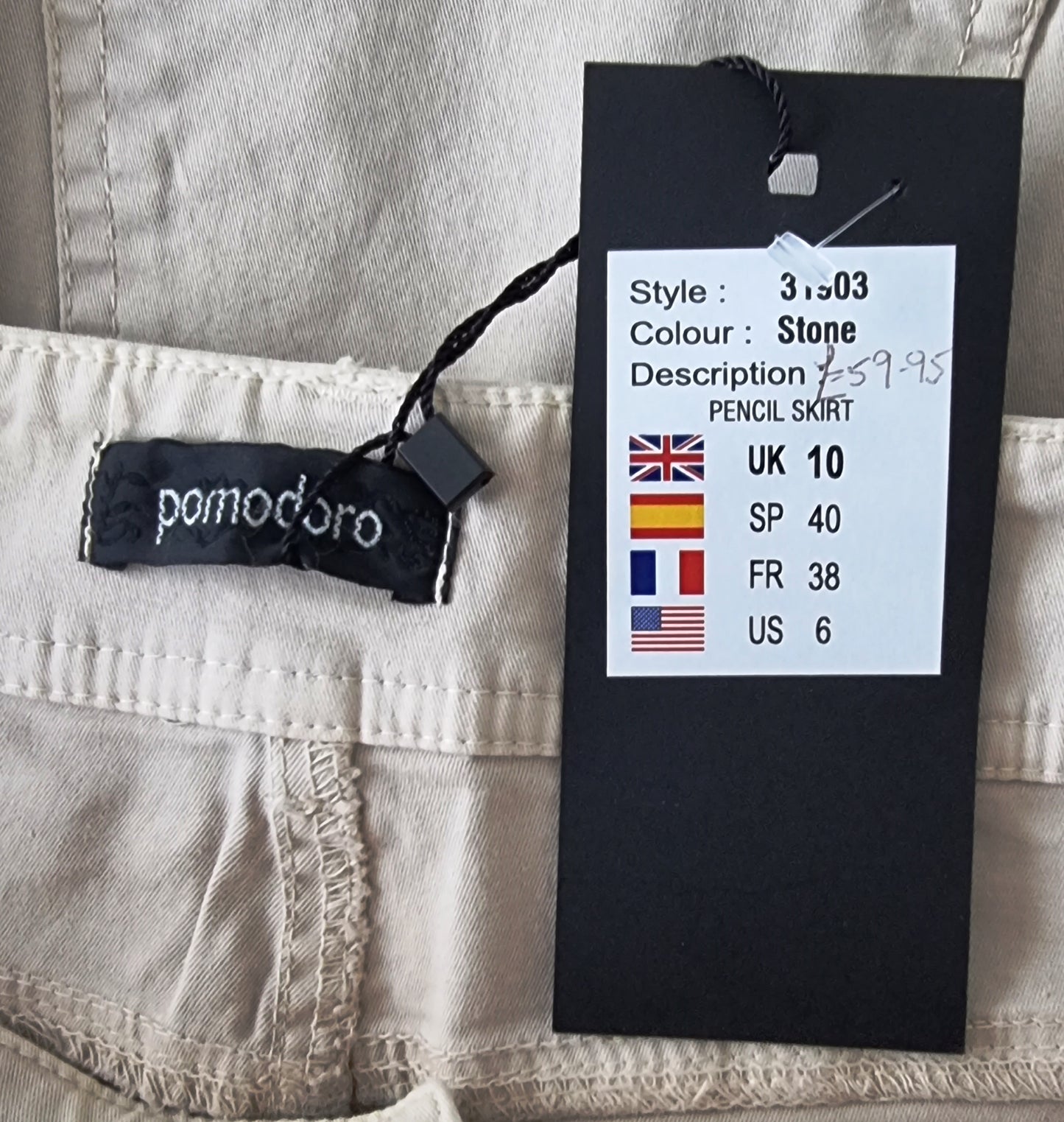 Pomodoro brand label on a pencil skirt with size and color information.