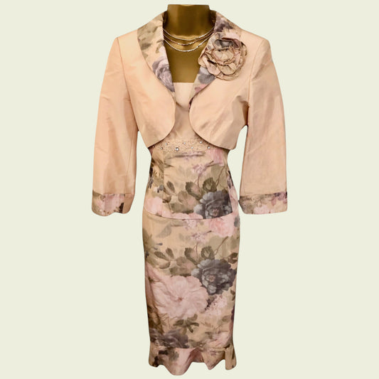 Floral dress with matching jacket on a mannequin against a beige background