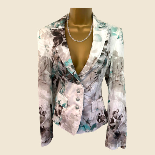 Floral patterned blazer on a mannequin against a white background
