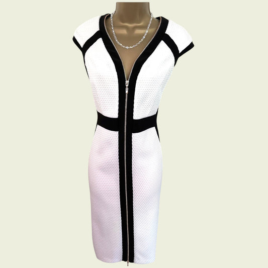 Mannequin wearing a white bodycon dress with front zip and black detail on a beige background