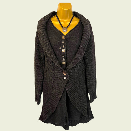 Dark gray knitted cardigan on a mannequin against a beige background