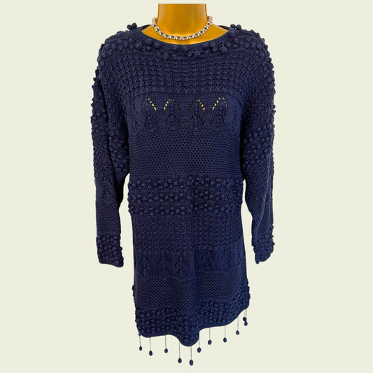 Navy blue knitted jumper on a mannequin with a plain background